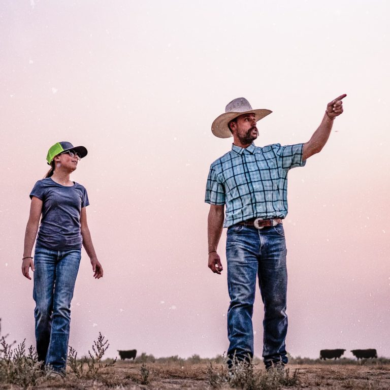 girl and rancher pointing